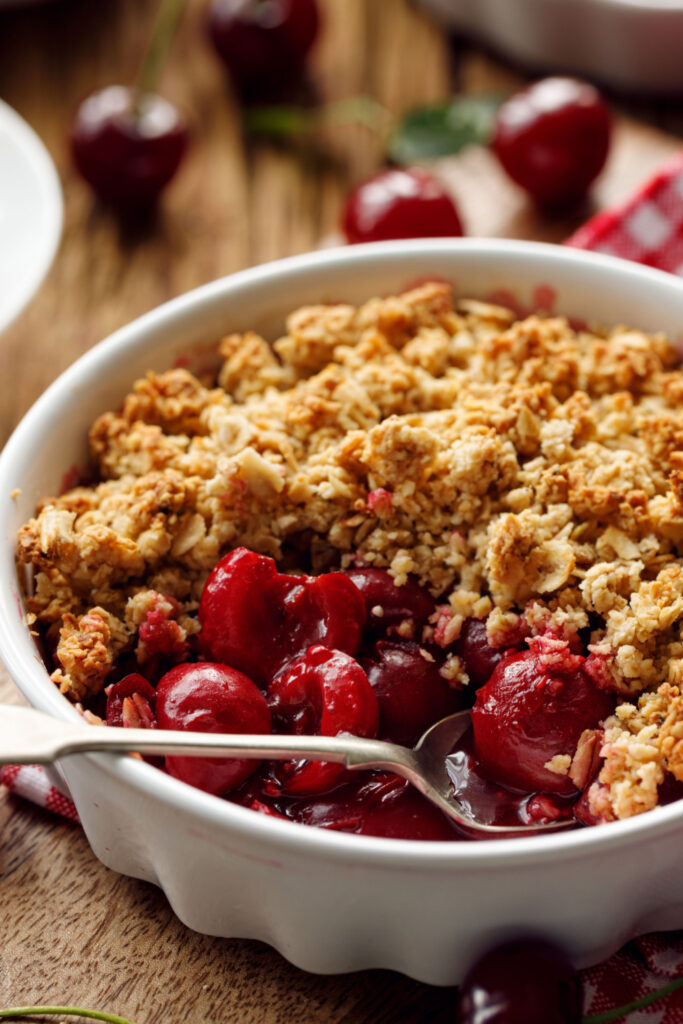 Cherry Crisp Topped With Rolled Oats on a Baking Dish